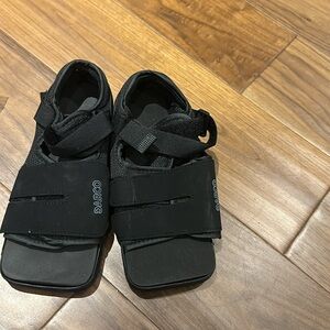 Woman’s surgical sandals with Velcro closures.  Only tried on.